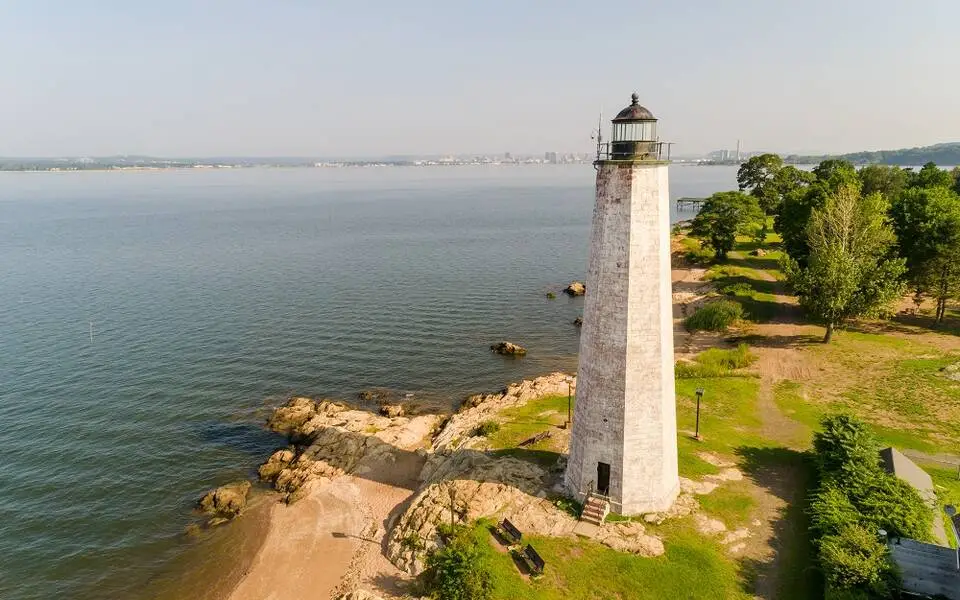 “Lighthouse Point Park lighthouse New Haven Connecticut coastline and beach”